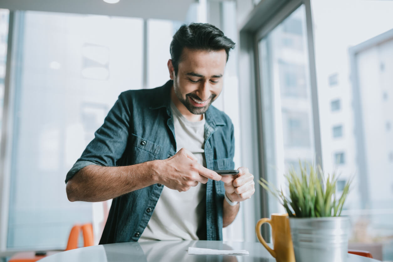 Employee making a mobile check deposit this pay period