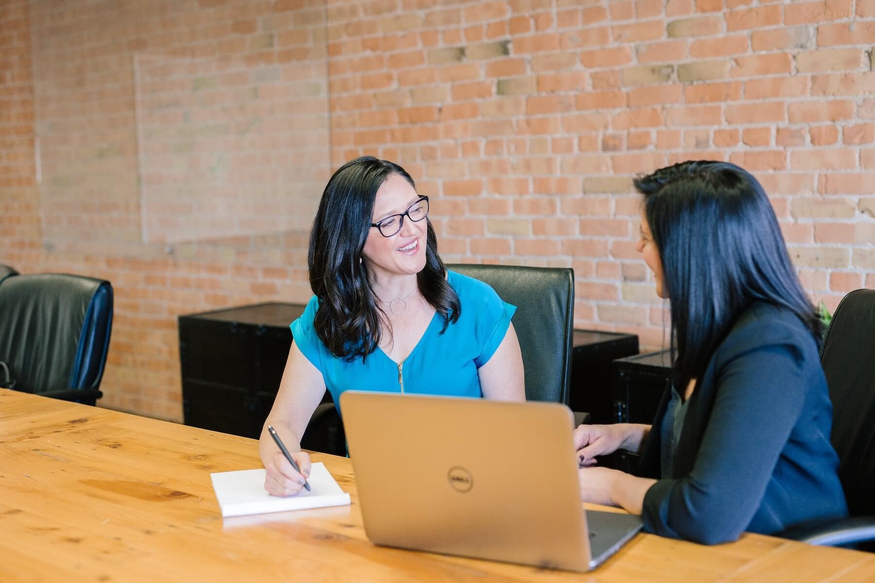 two women talking at architecture firm business development