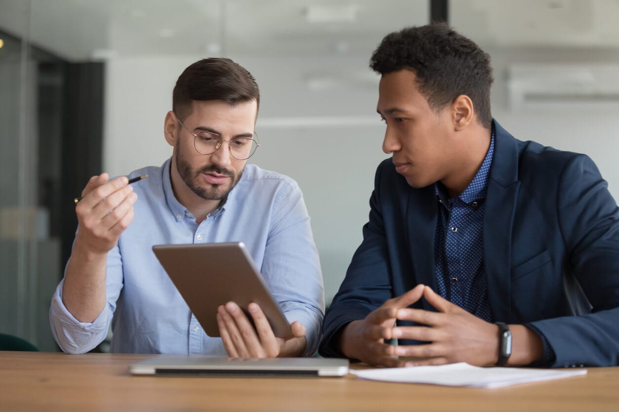 Manager and employee reviewing the specifics of a performance standard during a one-on-one